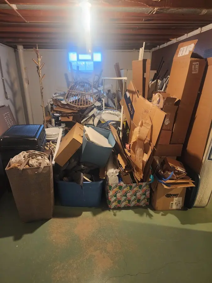 Roll-off dumpster container at job site for 2 Yard Dumpster Rental in Hartland